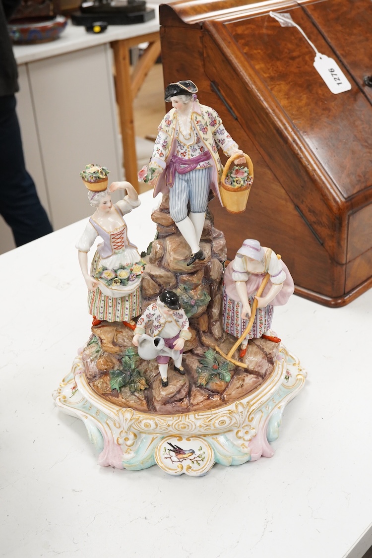 A pair of German porcelain figure groups, late 19th century and a Dresden centrepiece bowl-29cm high